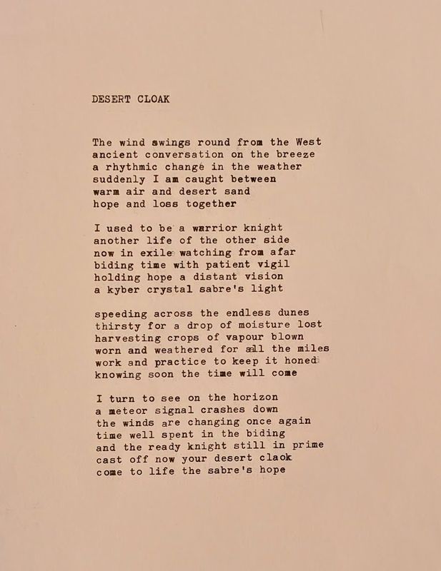 Desert Cloak — a typewritten poem on cream paper beginning 'The wind swings round from the West'.