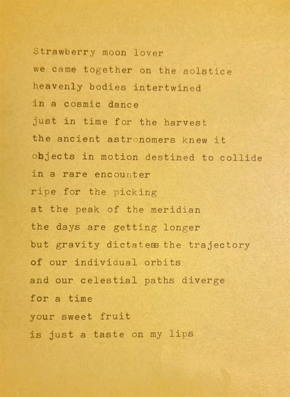 Strawberry Moon — a typewritten poem on gold paper beginning 'Strawberry moon lover'.